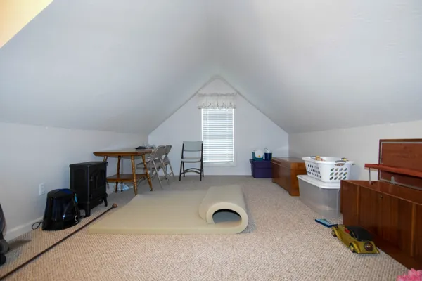 a livingroom with furniture and a window