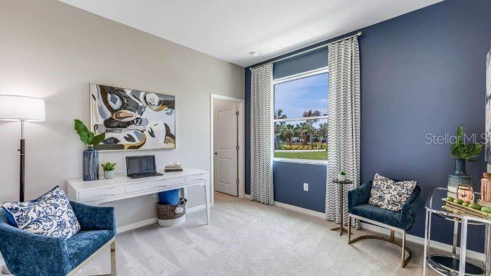 18391 Tavernside Trail Lakewood Ranch, FL 34211 - Photo 12 of 41 a living room with furniture and a window