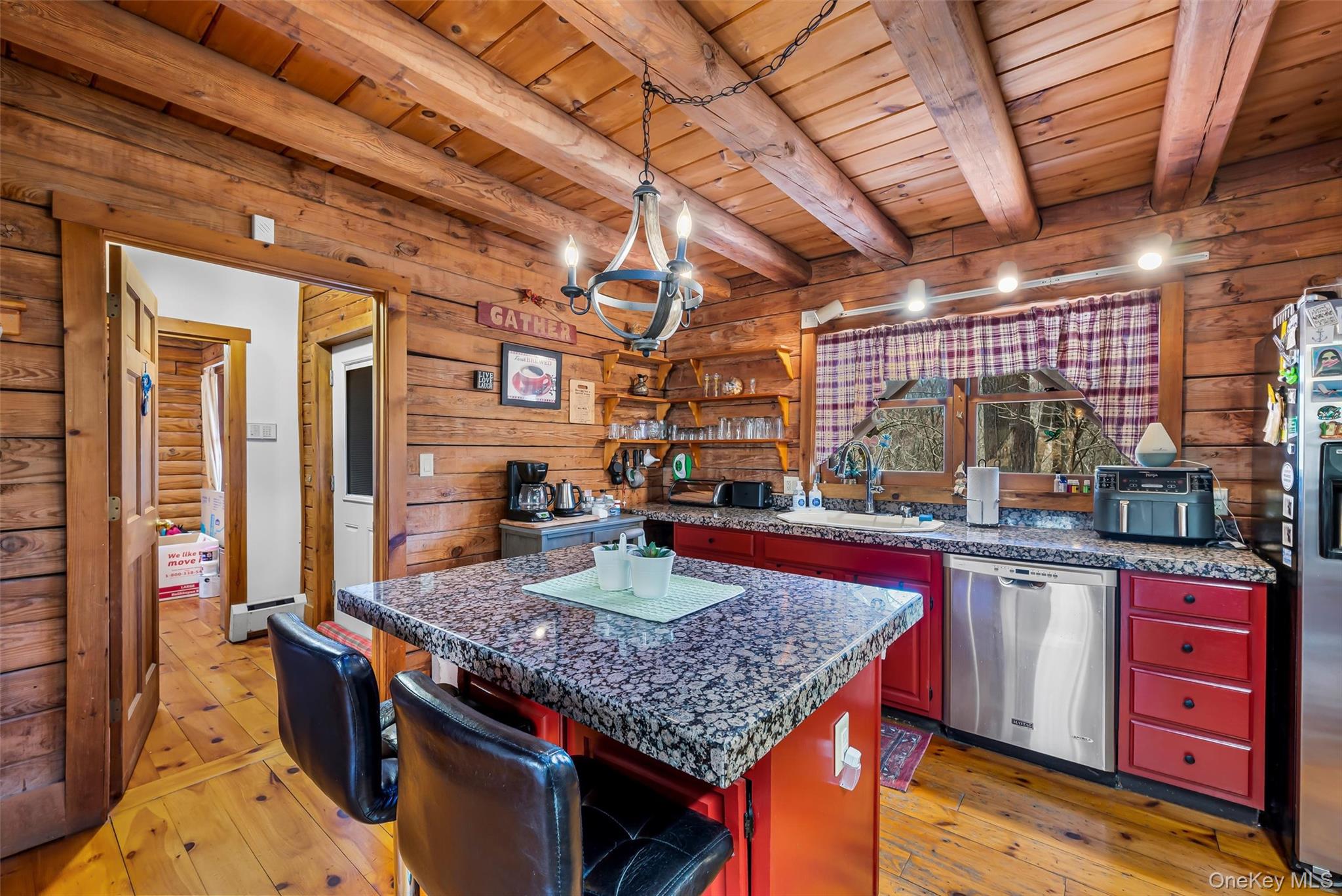1085 County Rte 17 Montgomery, NY 12549 - Photo 15 of 50 a kitchen with stainless steel appliances granite countertop a stove a sink and a wooden cabinets