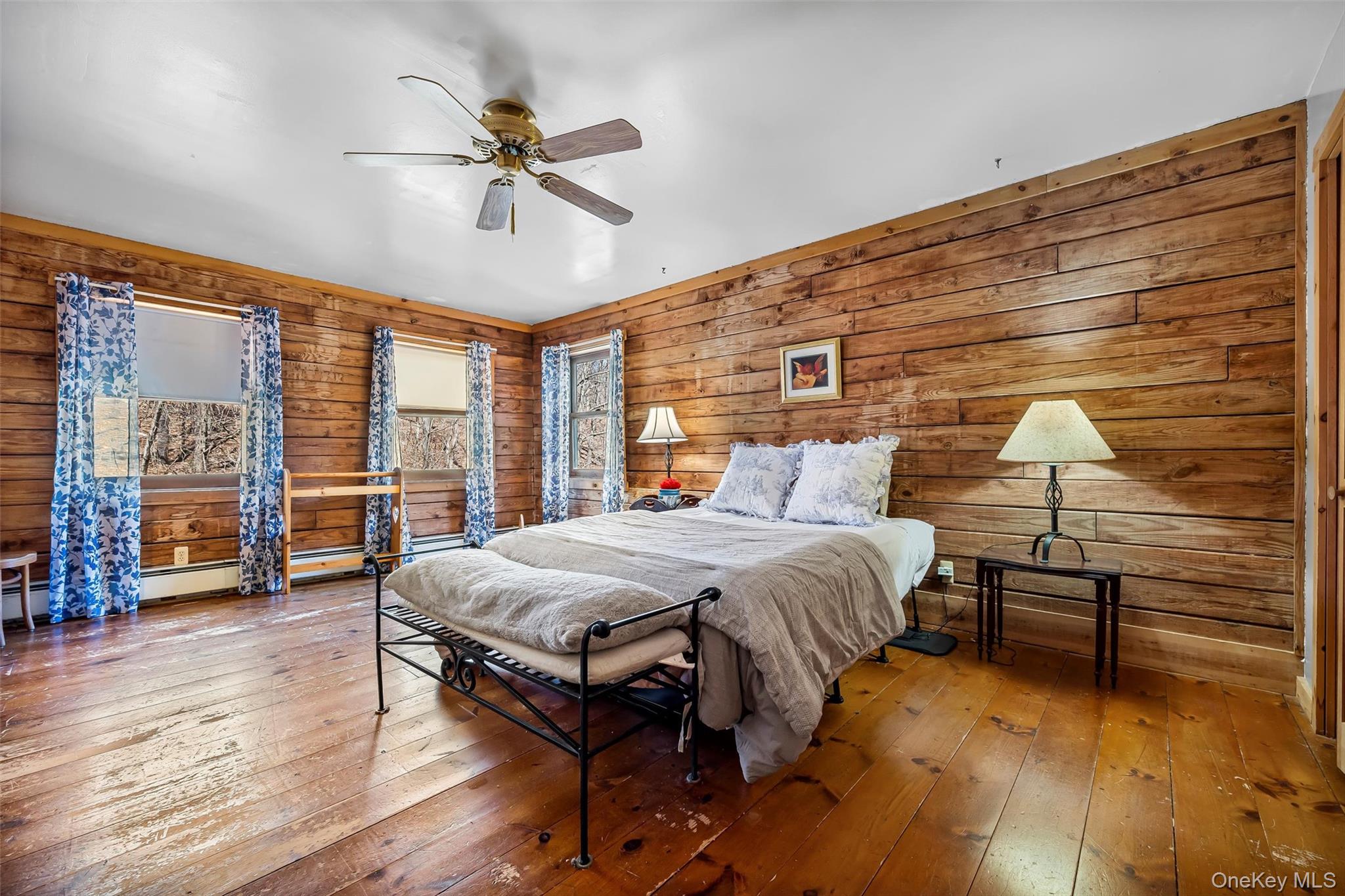 1085 County Rte 17 Montgomery, NY 12549 - Photo 26 of 50 a bedroom with a bed and wooden floor