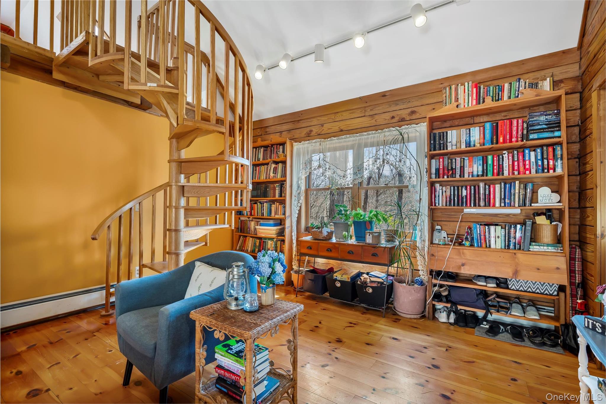 1085 County Rte 17 Montgomery, NY 12549 - Photo 35 of 50 a living room with furniture book shelf and a book shelf