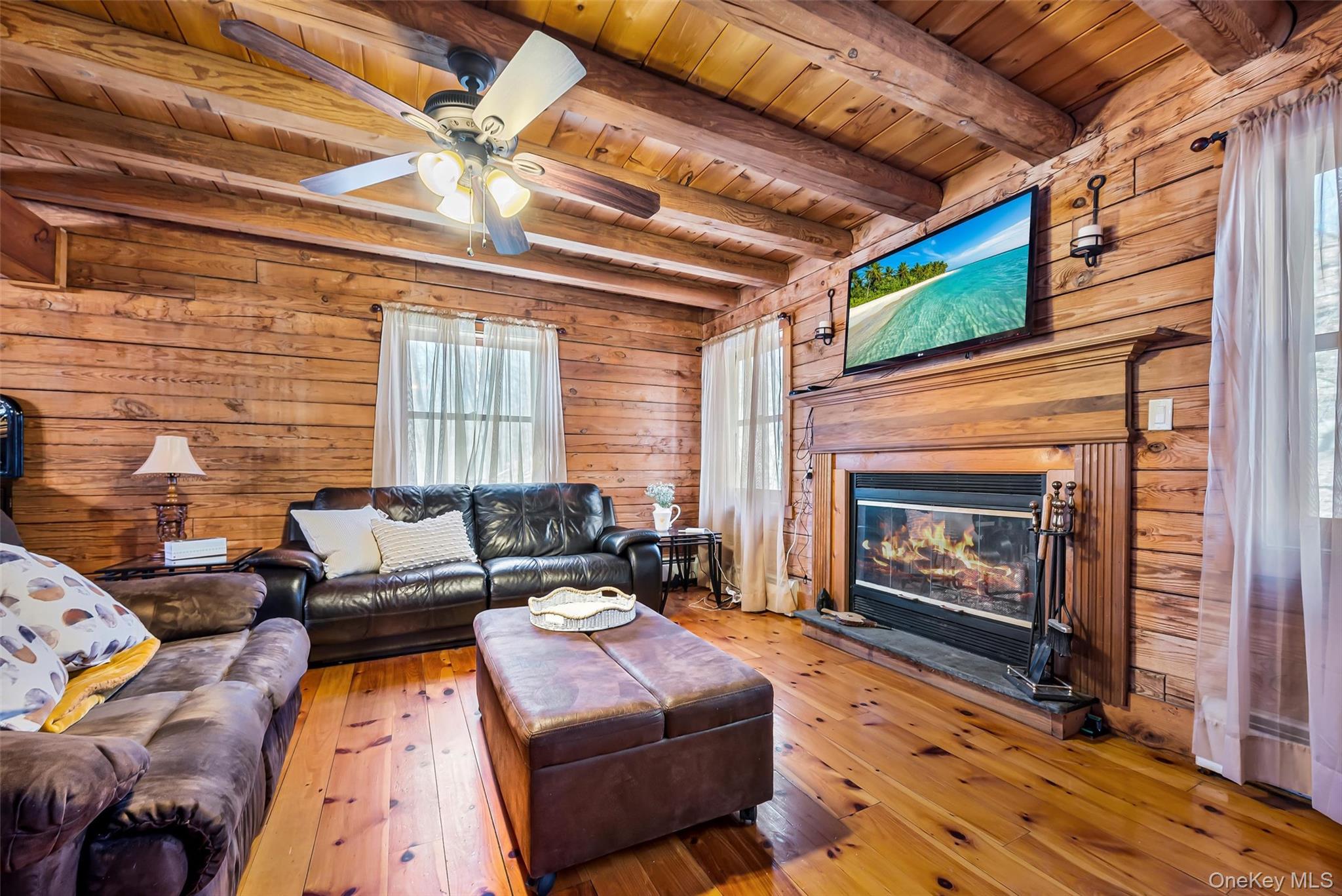1085 County Rte 17 Montgomery, NY 12549 - Photo 10 of 50 a living room with furniture and a fireplace