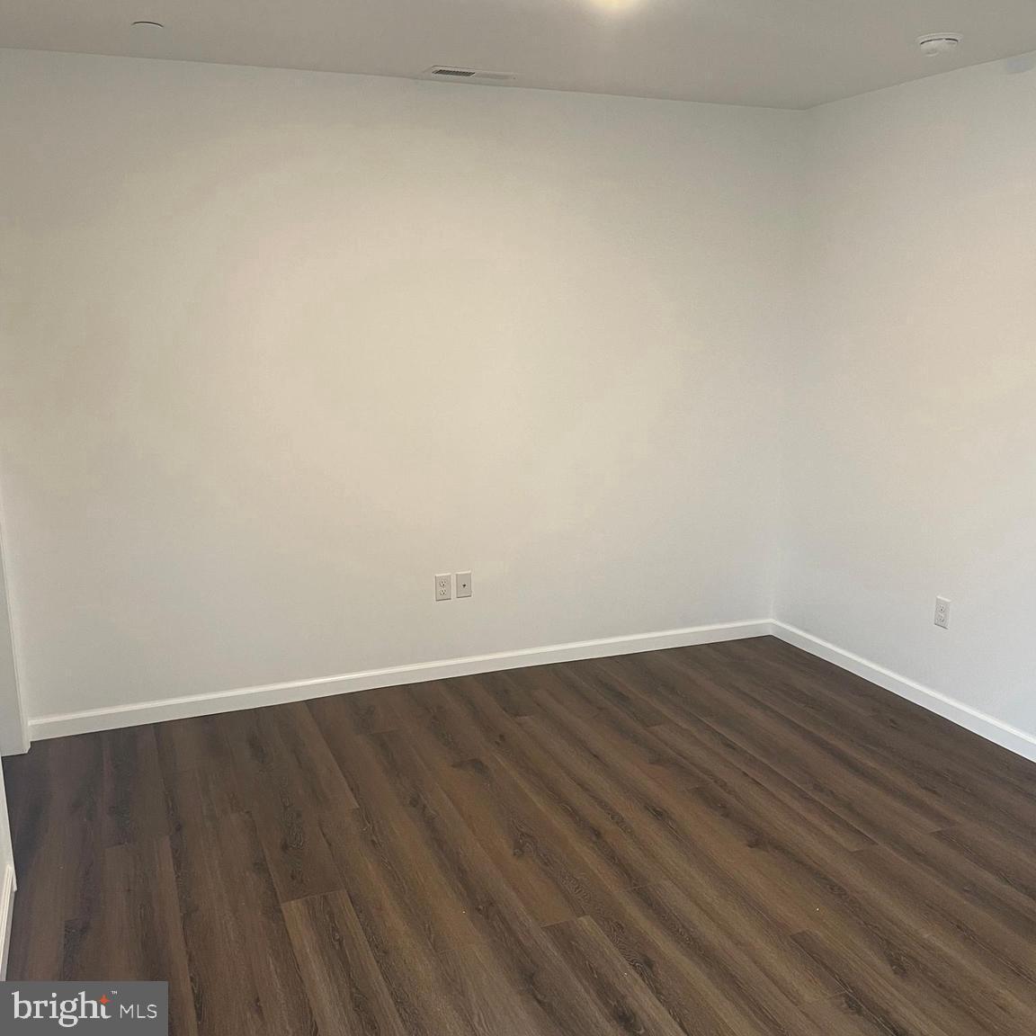 300 Collins Avenue, Unit 2 Hurlock, MD 21643 - Photo 2 of 5 a view of an empty room with wooden floor