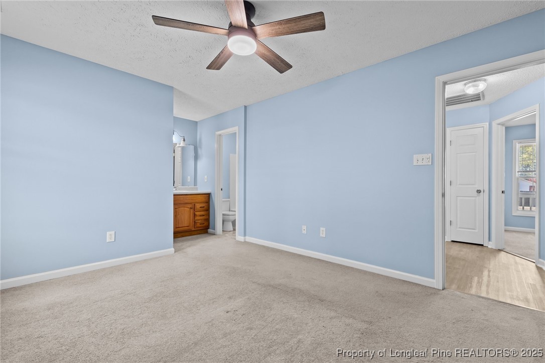 1205 Hobson Road Raeford, NC 28376 - Photo 23 of 33 an empty room with closet and a ceiling fan