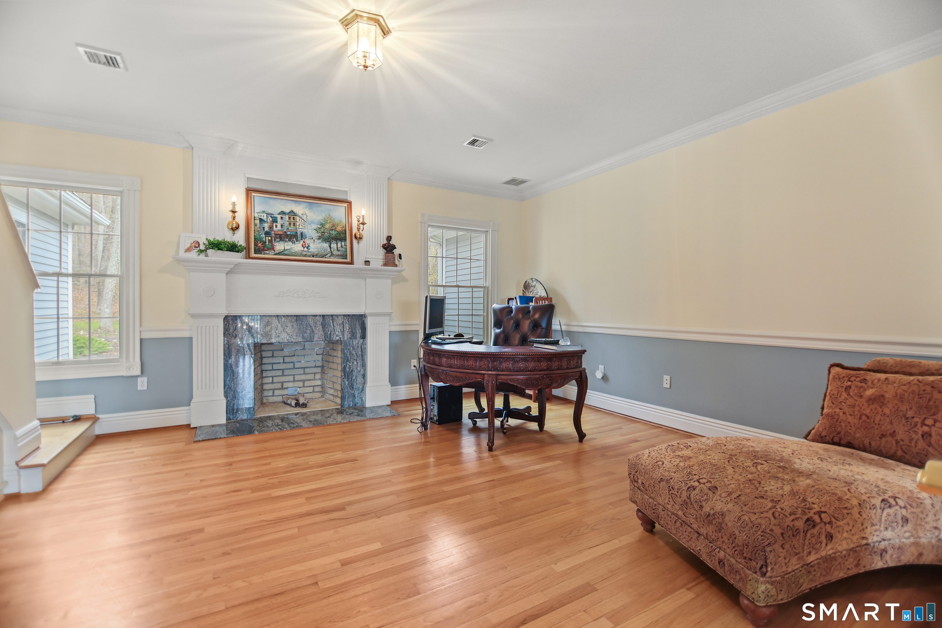 83 Bayberry Hill Road Avon, CT 06001 - Photo 21 of 34 a living room with furniture and a fireplace