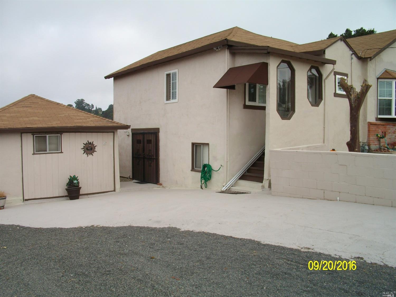 4249 Santa Rita Road El Sobrante, CA 94803 - Photo 1 of 1 a view of a house with wooden fence