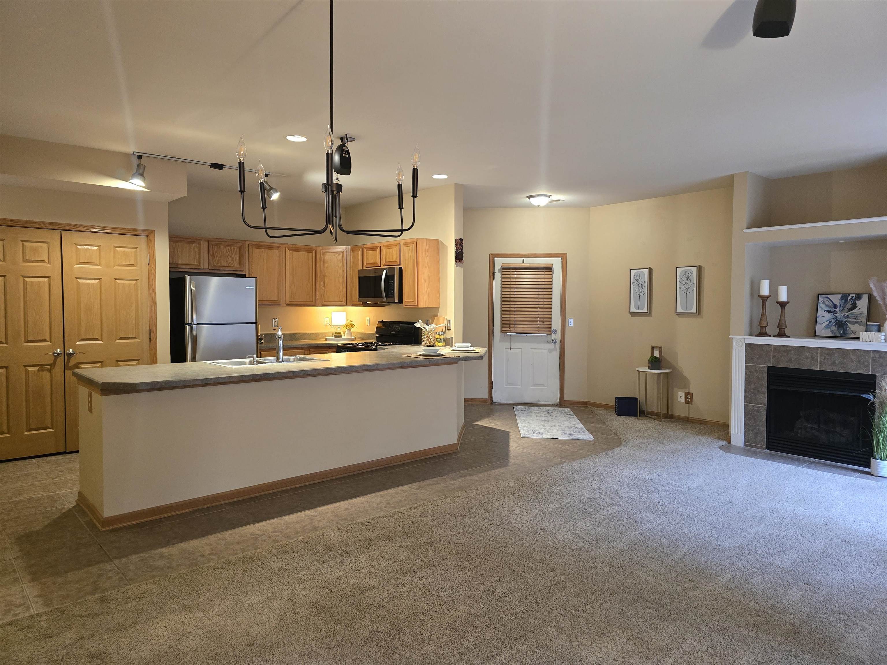 7593 Magnolia Trail Cherry Valley, IL 61016 - Photo 6 of 32 a view of a kitchen with refrigerator and window