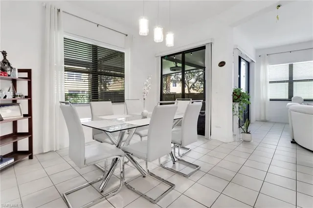 a view of a dining room with furniture and window
