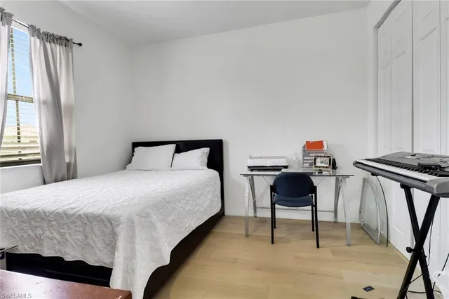 a bedroom with a bed furniture and a window