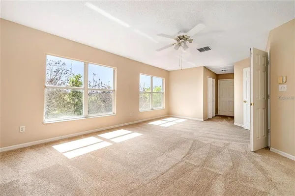 a view of an empty room with a window