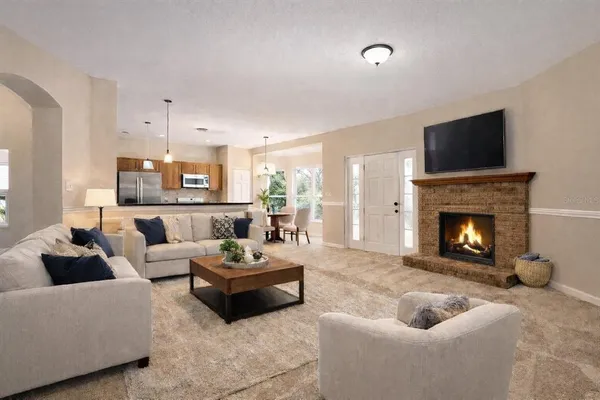 a living room with furniture and a fireplace