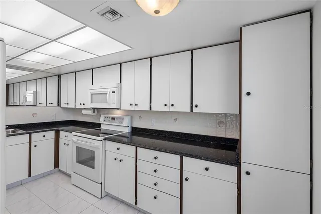 a view of a swimming pool and a yard