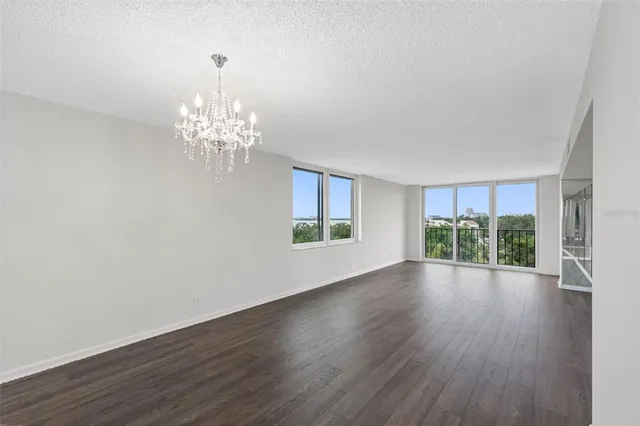 a kitchen with a refrigerator and a stove top oven