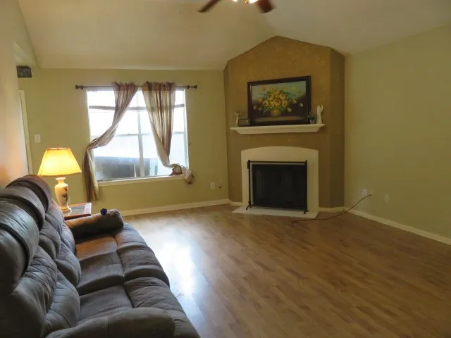 a kitchen with granite countertop cabinets stainless steel appliances and a sink