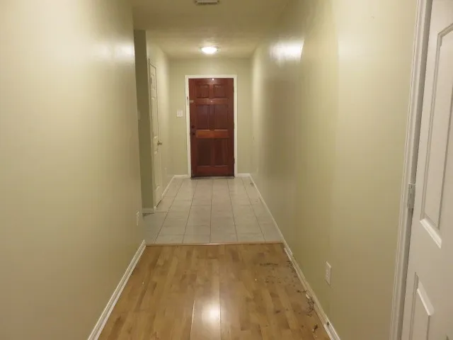 a bathroom with a toilet and a shower curtain