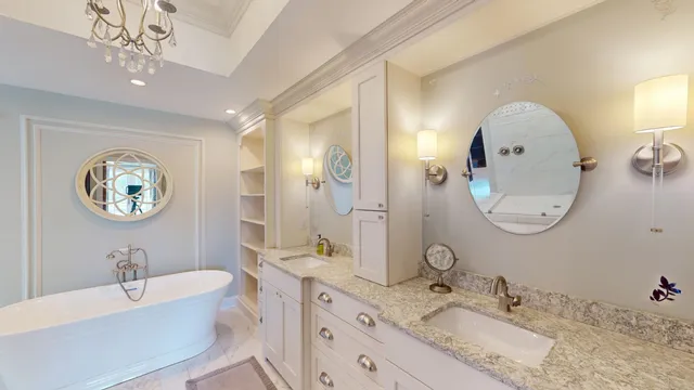 a bathroom with a granite countertop sink mirror and vanity