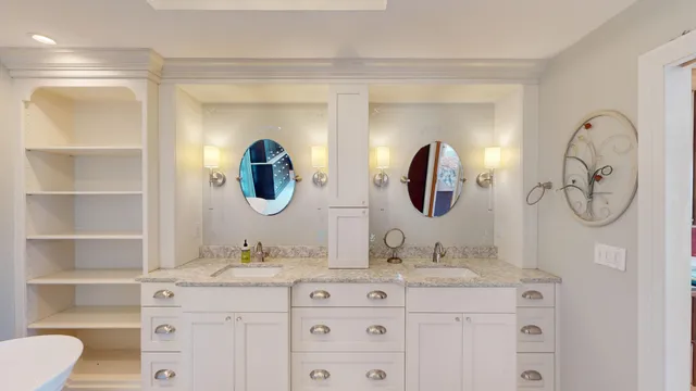 a bathroom with a double vanity sink and a mirror