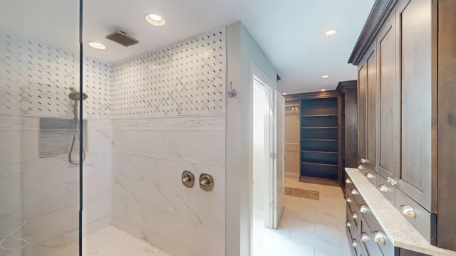 a bathroom with a shower and a sink