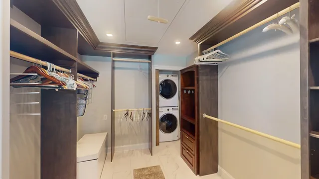 a spacious bathroom with a granite countertop sink a mirror and a shower