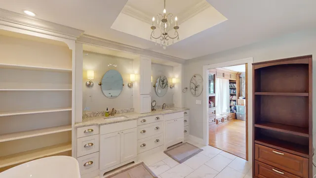 a bedroom with a bed and glass door