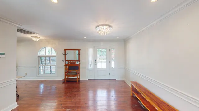 a bathroom with a sink shower and a mirror