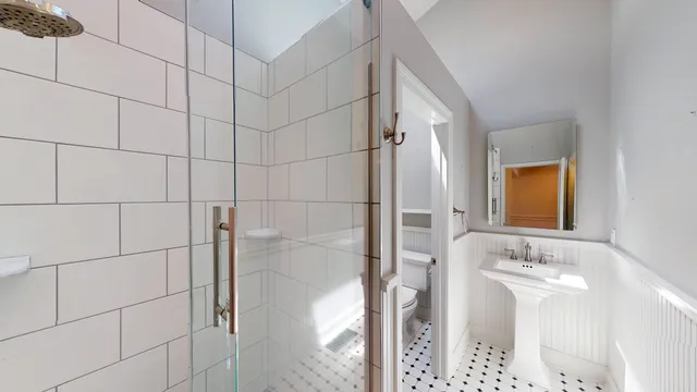 a bedroom with a large bed and a large window