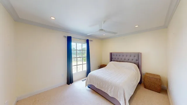 a kitchen with a stove a sink and dishwasher with wooden floor