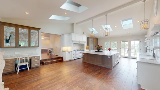 a kitchen with counter top space and a wooden floor