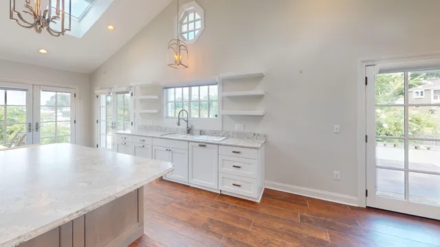 a view of a swimming pool with an outdoor seating and a yard