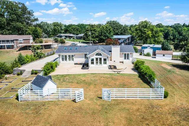 a view of houses with outdoor space and swimming pool