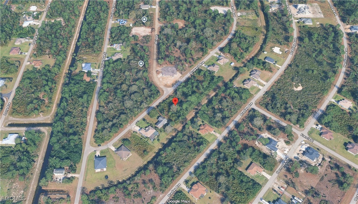 329 Broward Avenue Lehigh Acres, FL 33974 - Photo 6 of 9 an aerial view of a city