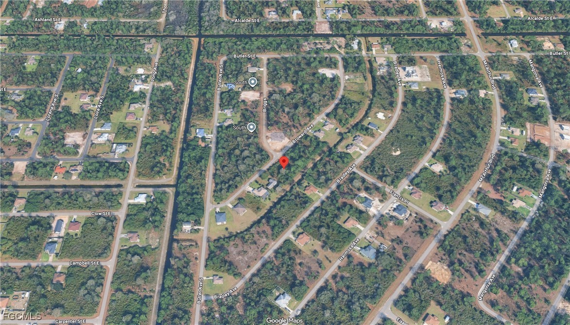 329 Broward Avenue Lehigh Acres, FL 33974 - Photo 7 of 9 a bird view of lake