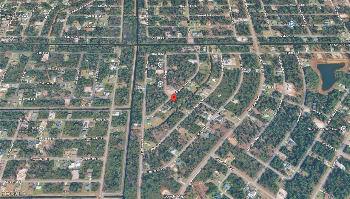 329 Broward Avenue Lehigh Acres, FL 33974 - Photo 8 of 9 a view of residential houses with sky view