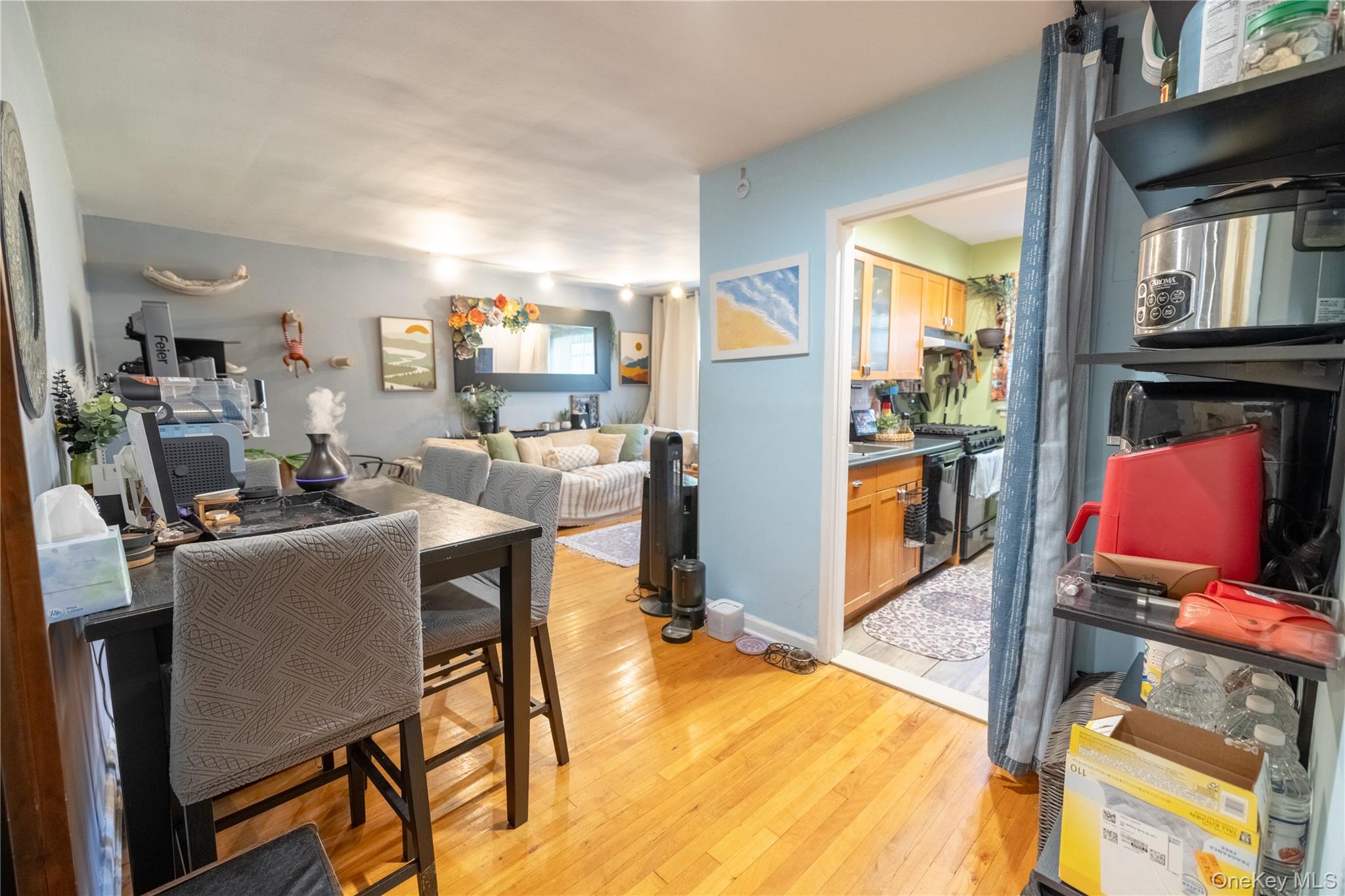 221 Middle Neck Road, Unit M2 Great Neck, NY 11021 - Photo 4 of 15 Dining space with light wood-style flooring and baseboards