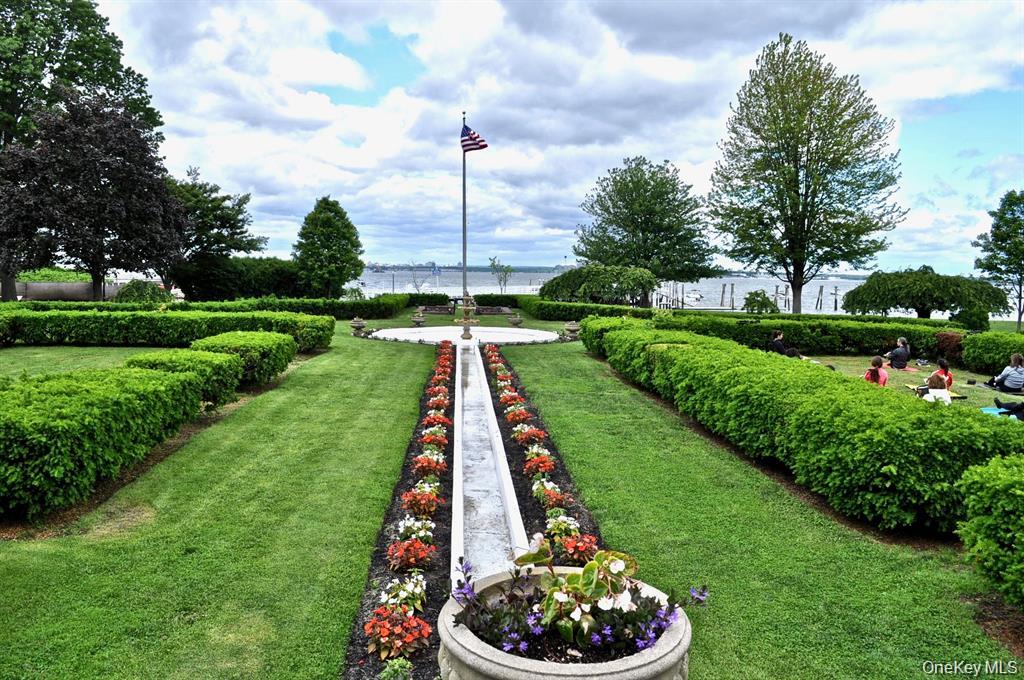 221 Middle Neck Road, Unit M2 Great Neck, NY 11021 - Photo 10 of 15 View of green lawn featuring a water view