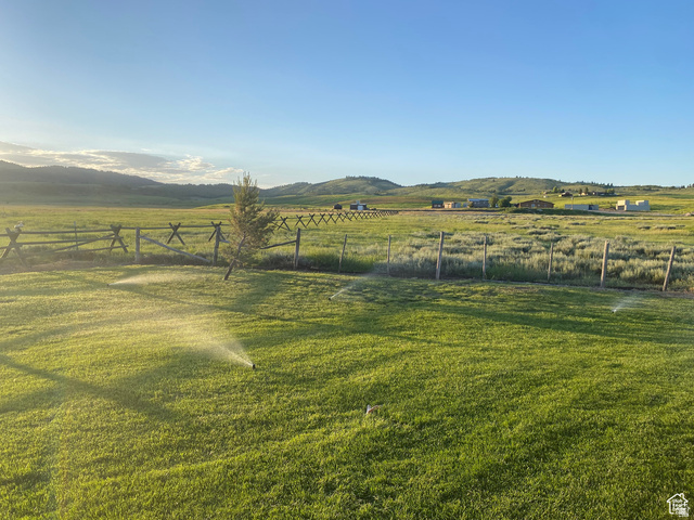 79 Auburn Forest Road Auburn, WY 83111 - Photo 12 of 76 View of yard with a rural view and a mountain view