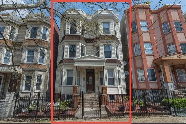 a front view of a multi story residential apartment building