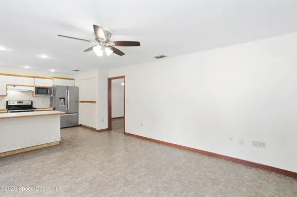 a view of an empty room with a window