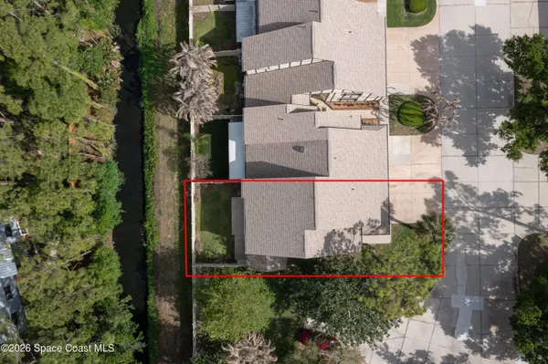 a view of a swimming pool with a yard