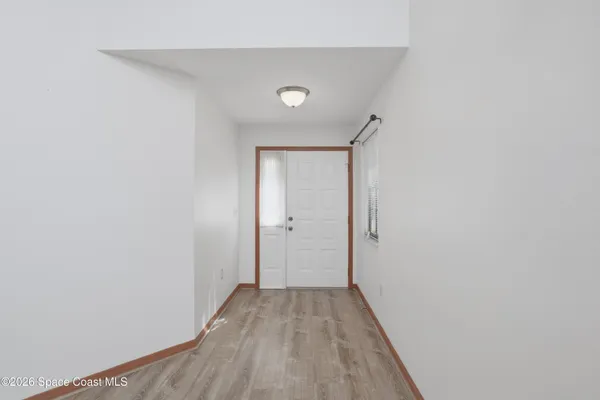 a view of a livingroom with wooden floor