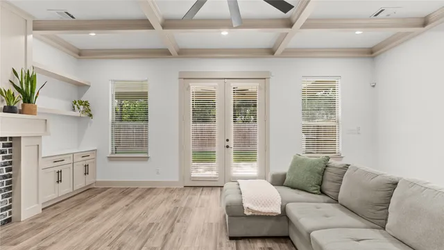 a living room with furniture and windows