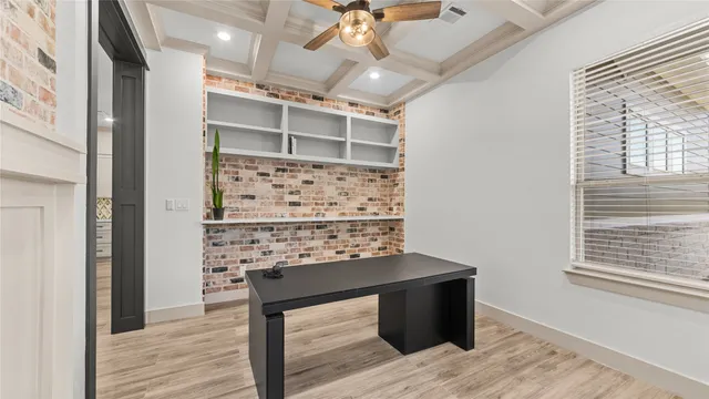 a view of workspace with wooden floor