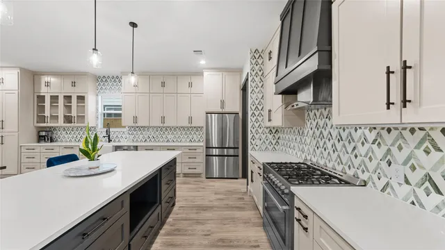 a kitchen with a sink stove and refrigerator
