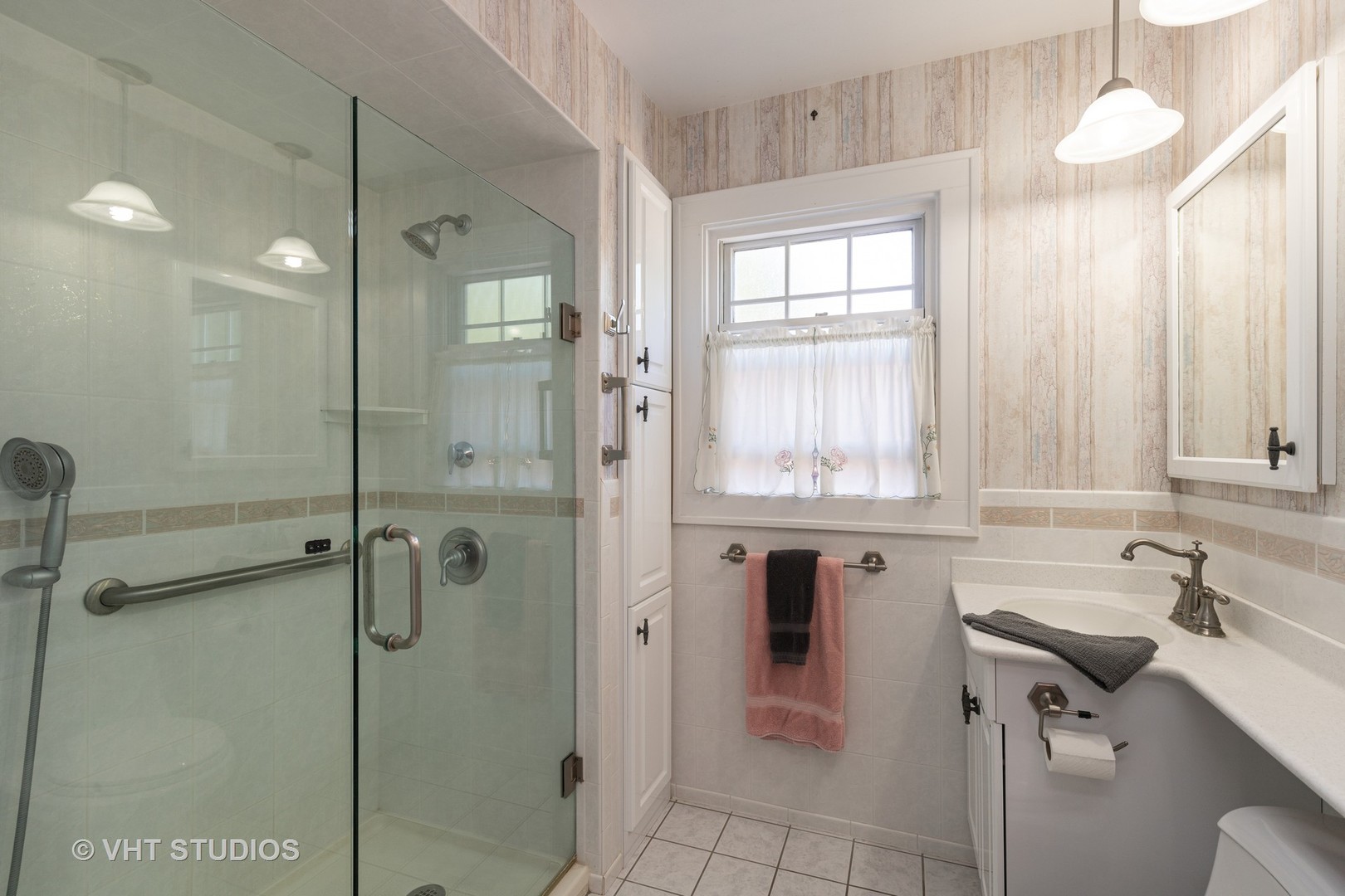 136 Barrypoint Road Riverside, IL 60546 - Photo 13 of 19 a bathroom with a shower sink and mirror
