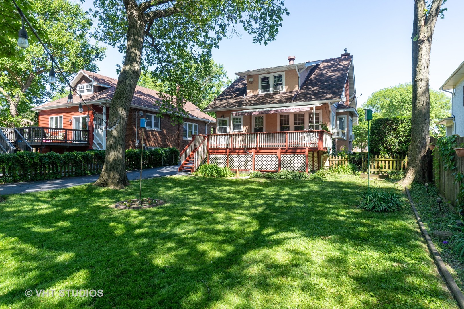 136 Barrypoint Road Riverside, IL 60546 - Photo 16 of 19 a front view of a house with a yard table and chairs