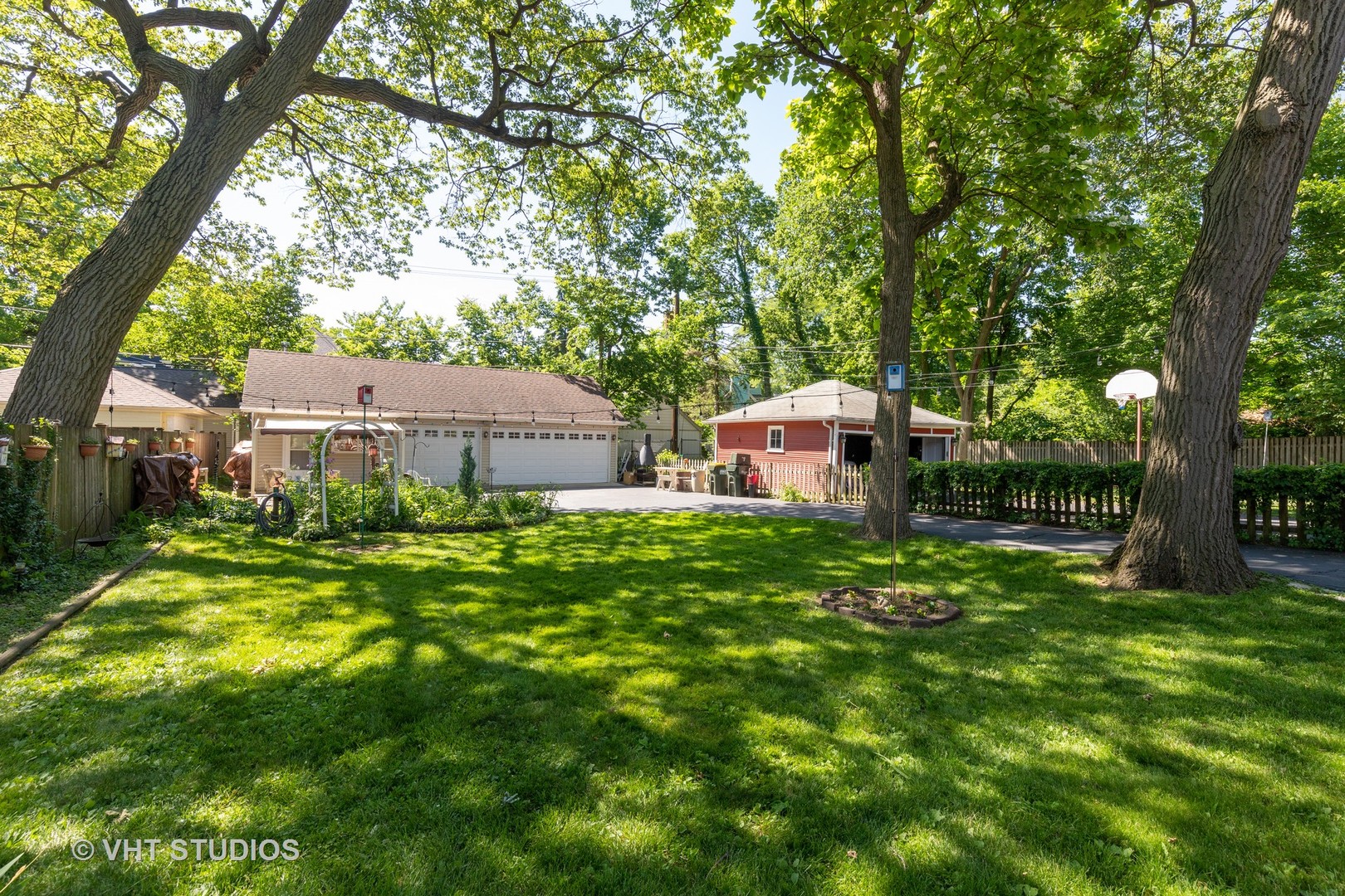 136 Barrypoint Road Riverside, IL 60546 - Photo 17 of 19 a front view of a house with garden
