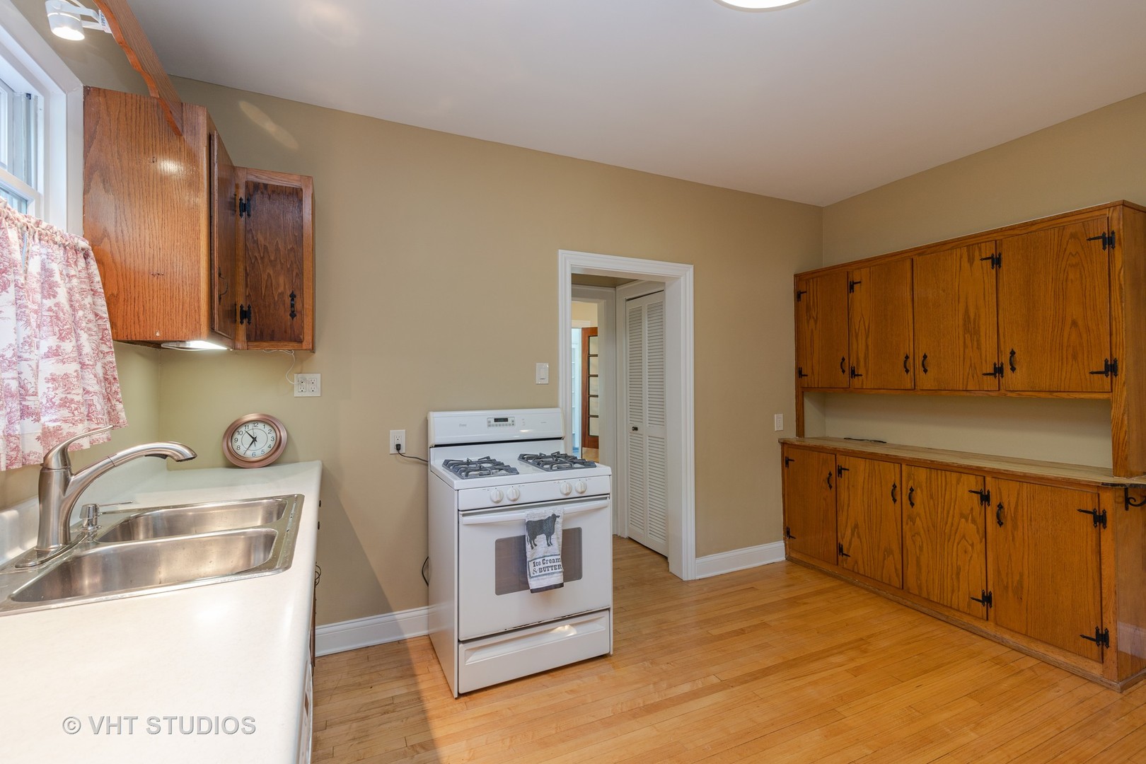 136 Barrypoint Road Riverside, IL 60546 - Photo 8 of 19 a kitchen with stainless steel appliances granite countertop a stove and a sink