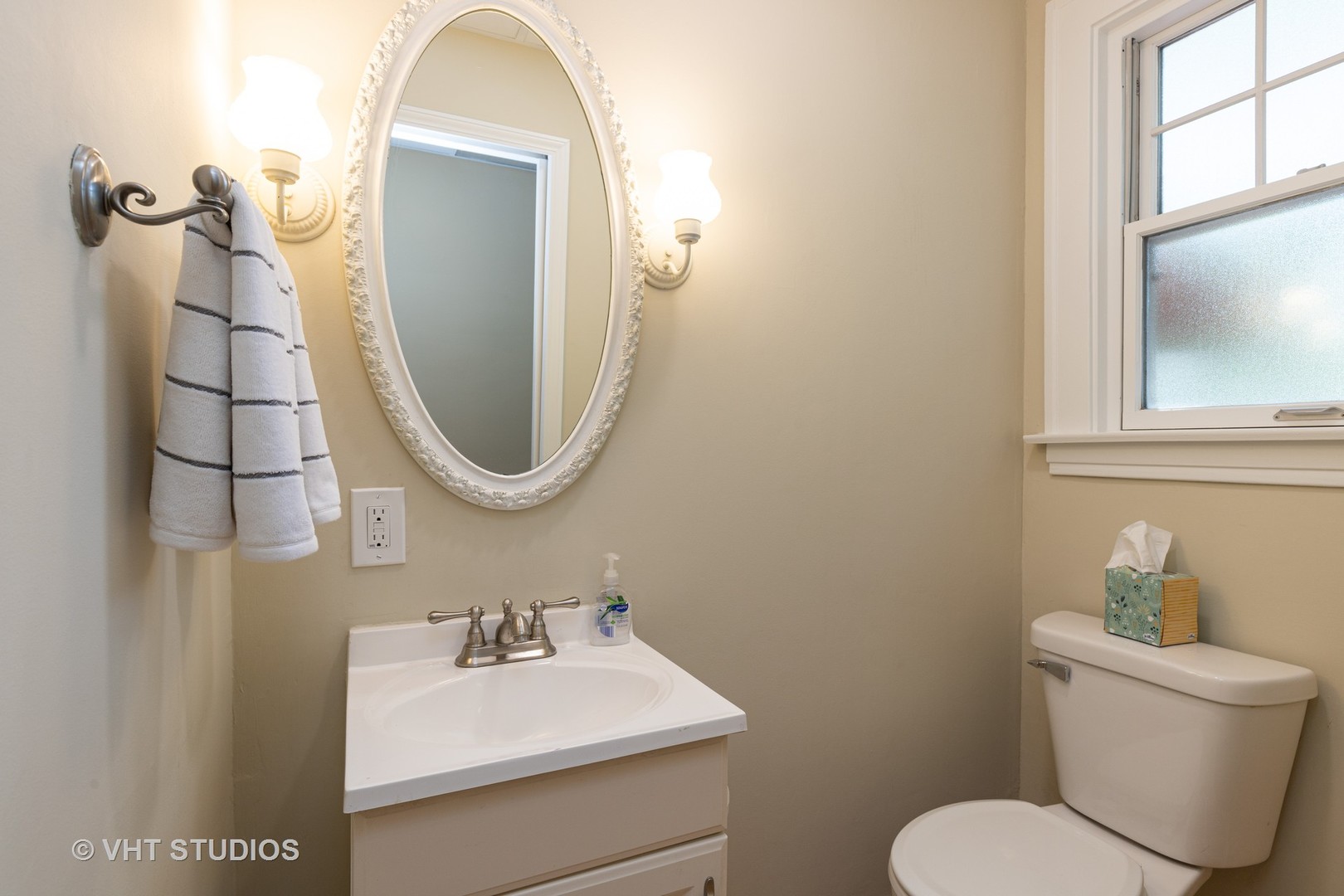136 Barrypoint Road Riverside, IL 60546 - Photo 10 of 19 a bathroom with a toilet sink and mirror