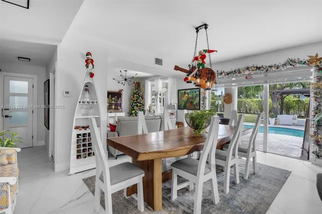 a dining room with furniture and window
