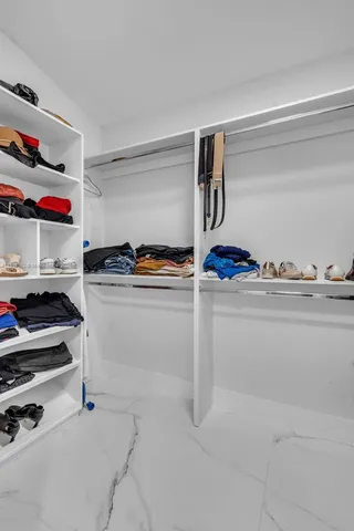 a bathroom with a double vanity sink tub and mirror